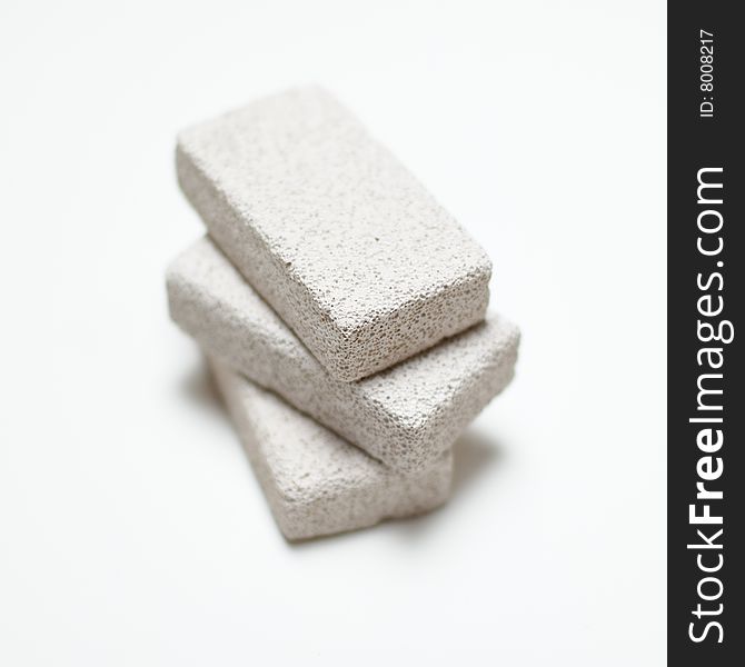 Stack of pumice stones on a white background.