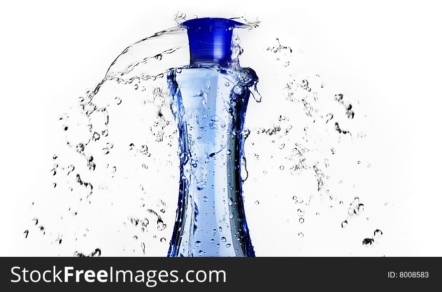 Blue shampoo bottle with water splashing around it. Blue shampoo bottle with water splashing around it.