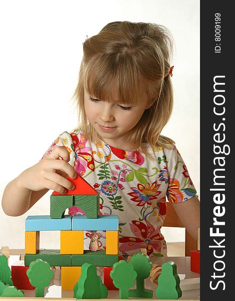 Little girl playing with cubes