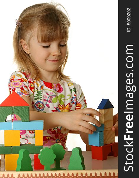 Little girl playing with cubes