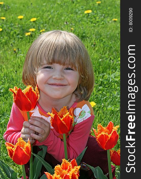 Portrait of beautiful girl with tulips