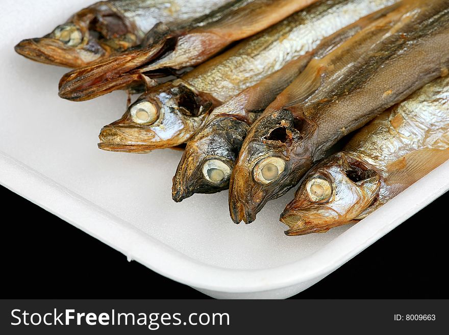 Dried capelin in the plastic container