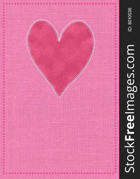 Postcard with a red heart on a fabric