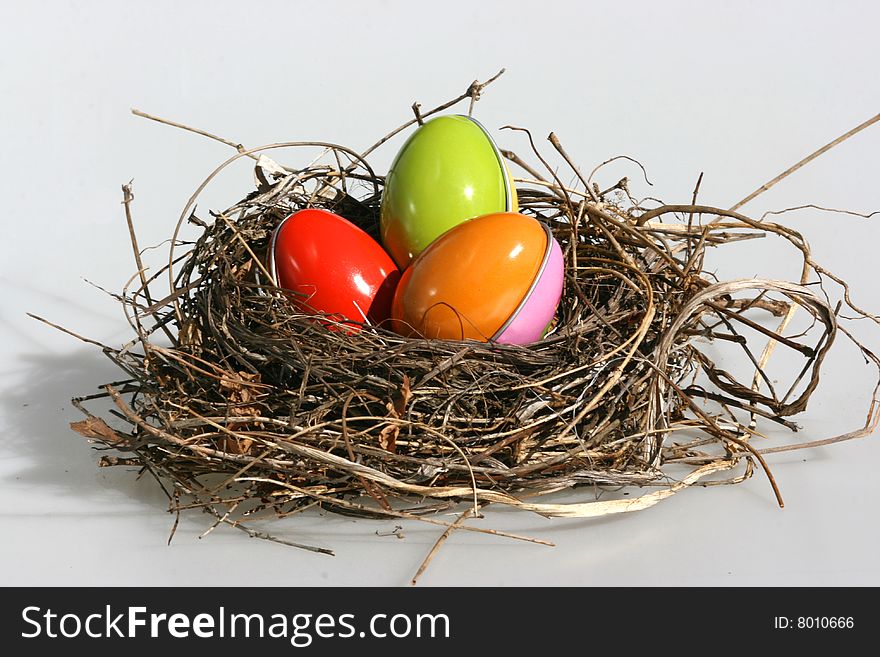 Birds nest with colorful Easter eggs
