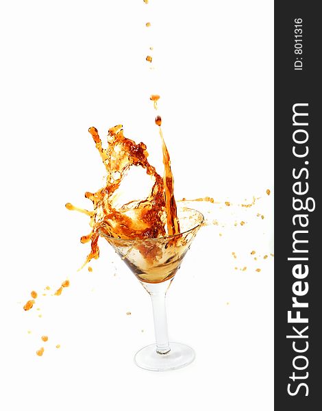 Wine being poured into a wine glass on white background
