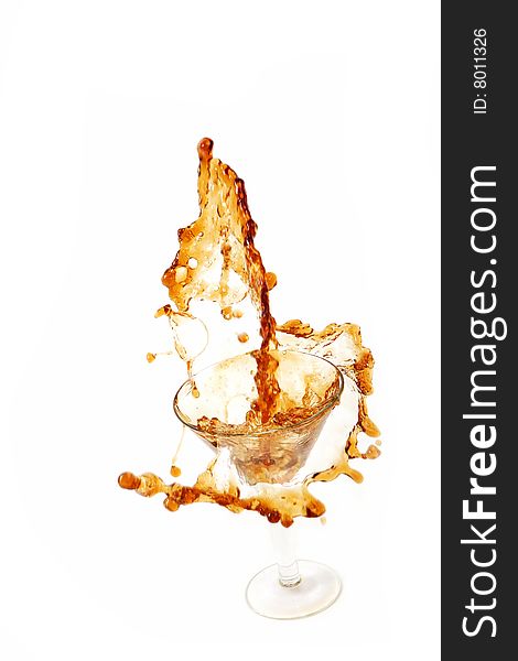 Wine being poured into a wine glass on white background
