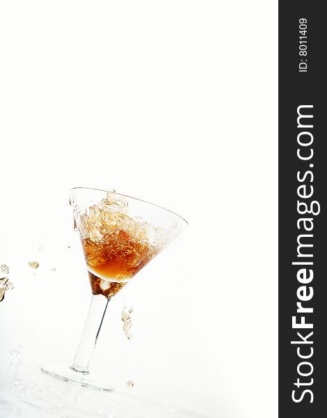 Wine being poured into a wine glass on white background