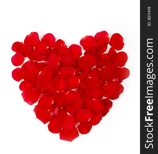 Heart made with red rose petals isolated on white background