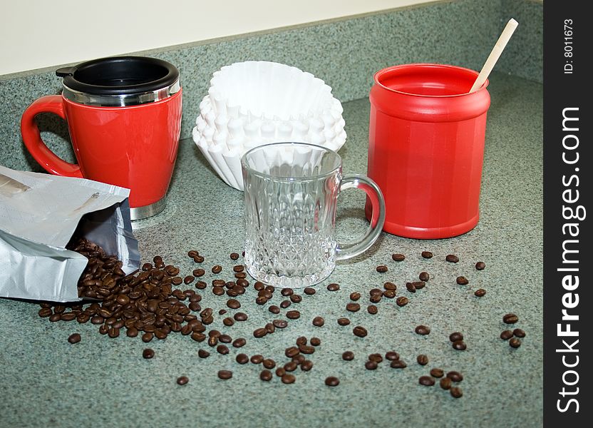 Coffee items and ingredients sitting on a home kitchen counter. Coffee items and ingredients sitting on a home kitchen counter.