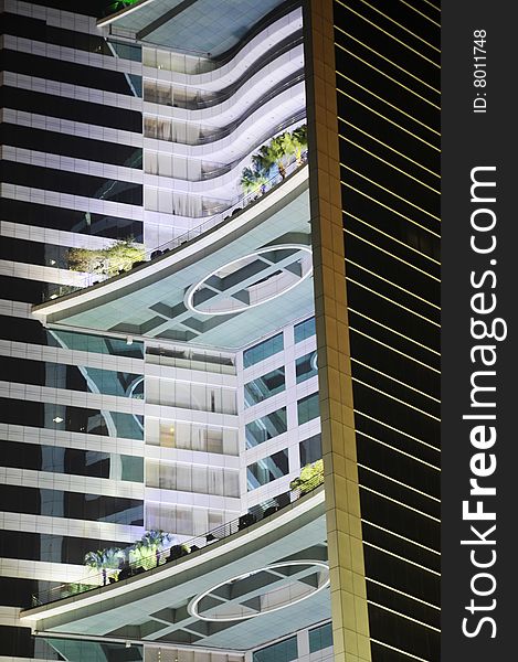 The steel structure glass curtain high rise building  with roof garden at night. The steel structure glass curtain high rise building  with roof garden at night.