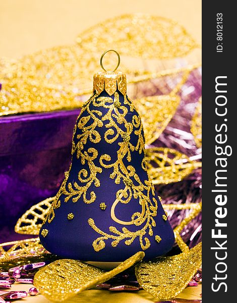 Violet celebration bells and golden leaves