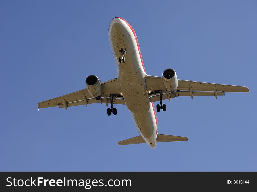Modern airliner taking off in blue sky