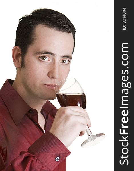 Young dark-haired man with red shirt and glass of red wine isolated on white background. Young dark-haired man with red shirt and glass of red wine isolated on white background.