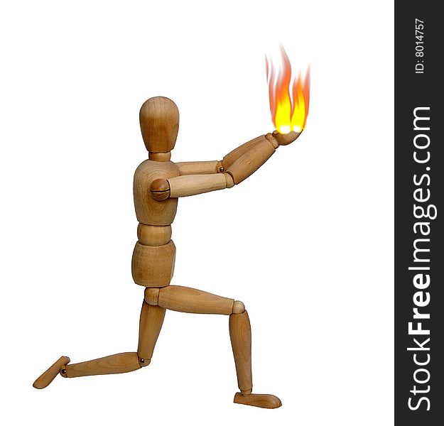 The wooden doll holds a flame in hands. The wooden doll holds a flame in hands