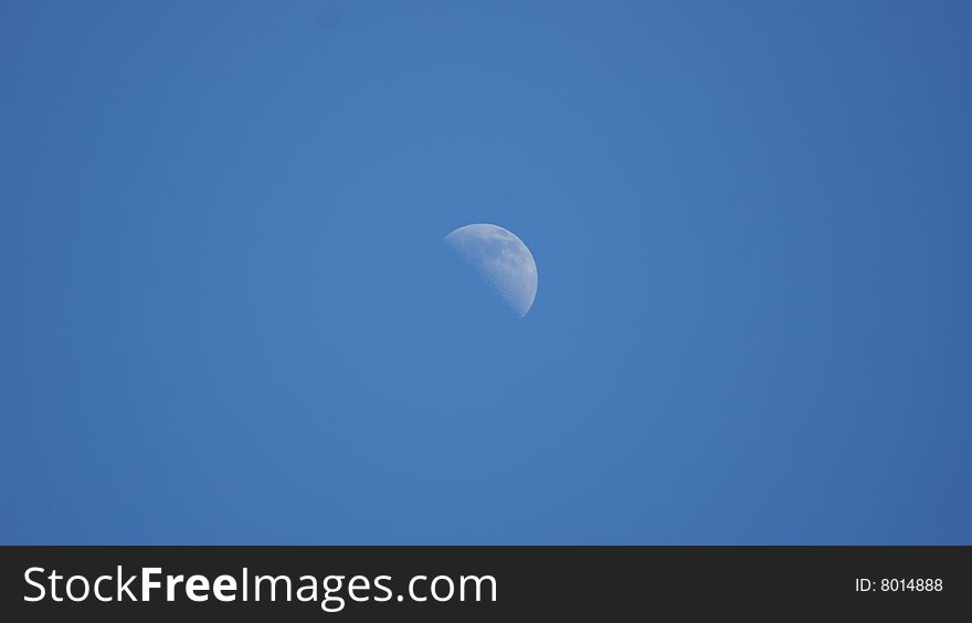 A picture of the moon high in the sky at 1:30 PM. A picture of the moon high in the sky at 1:30 PM