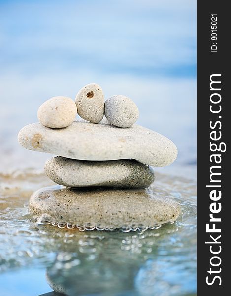 Sea pebble and quiet waves on a summer beach. Sea pebble and quiet waves on a summer beach