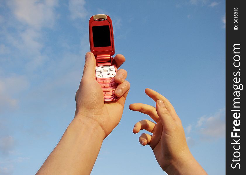 Hand holding a mobile phone for support