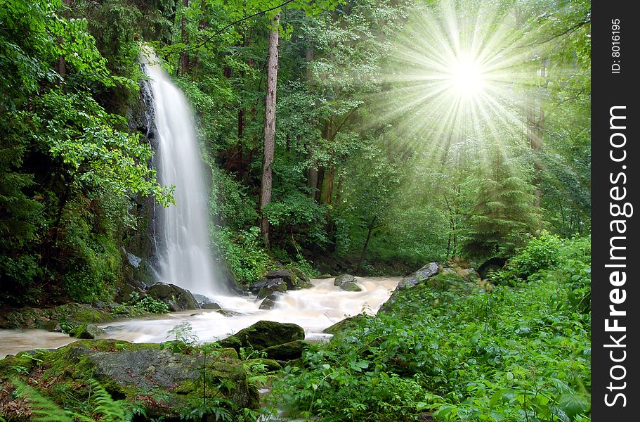 A beautiful waterfall with sun rays. A beautiful waterfall with sun rays