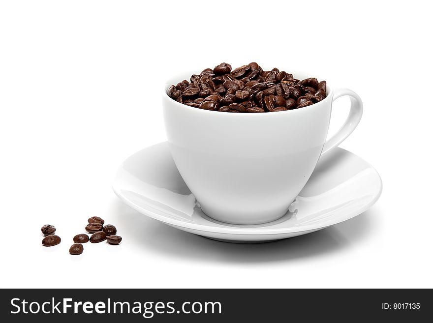 Cup of coffee beans isolated over white background