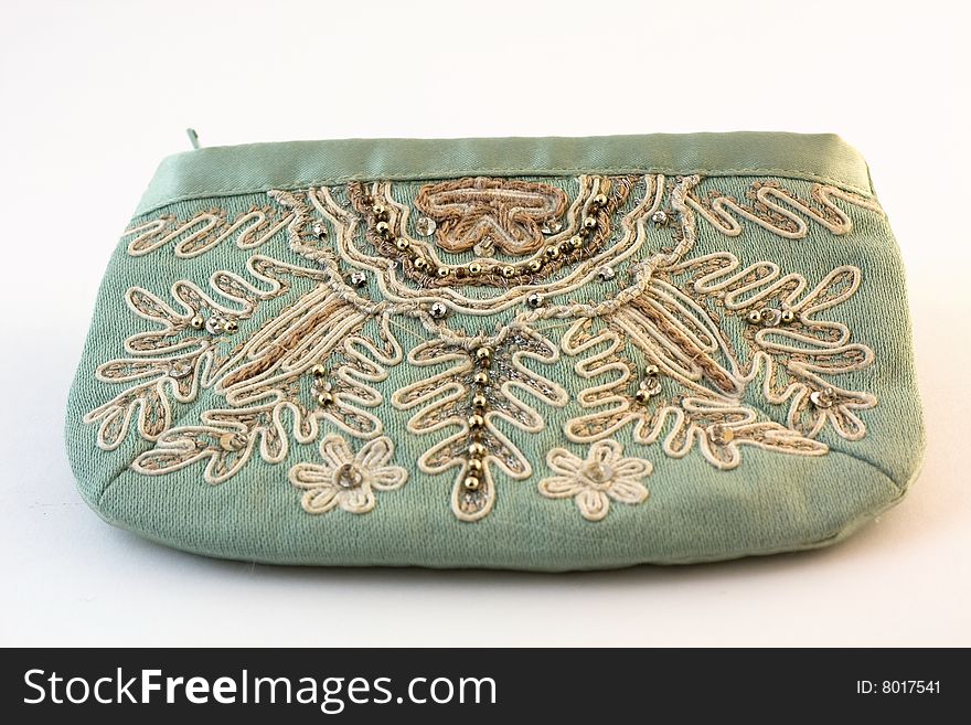 Purse with an embroidery on a white background. Purse with an embroidery on a white background