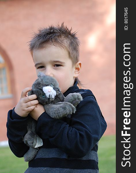 Boy with a toy kitten