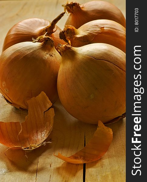Five onion ready for chopping board