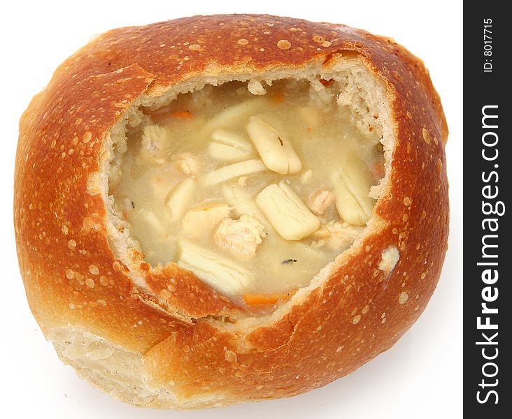 Sourdough bread filled with chicken noodle soup. Sourdough bread filled with chicken noodle soup.