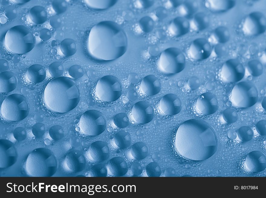 Blue water droplets background