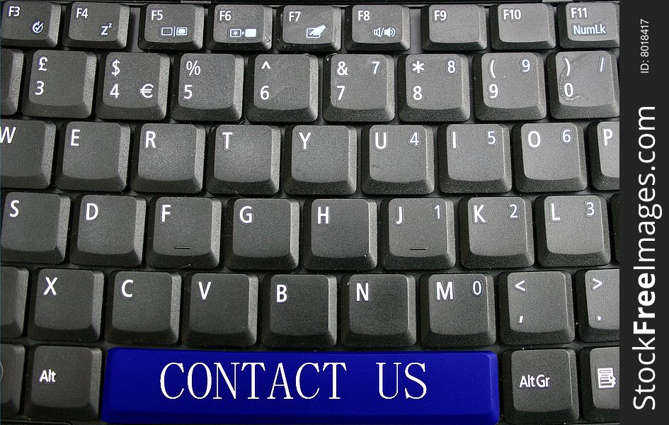 Computer keyboard with contact us on space bar. Computer keyboard with contact us on space bar