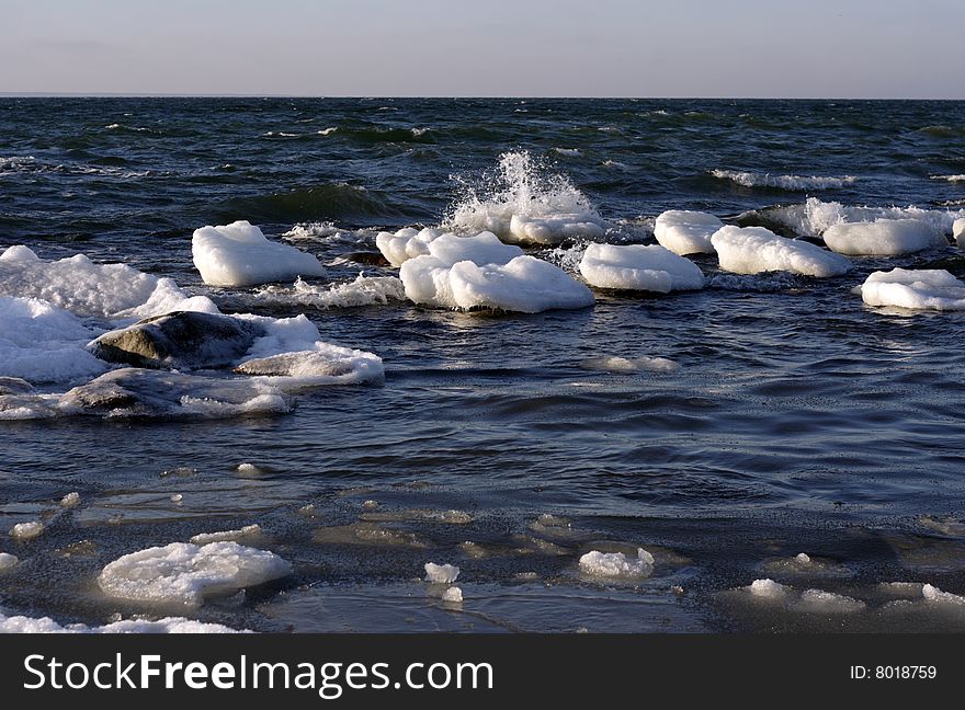 Cold February weather on waves of Baltic sea