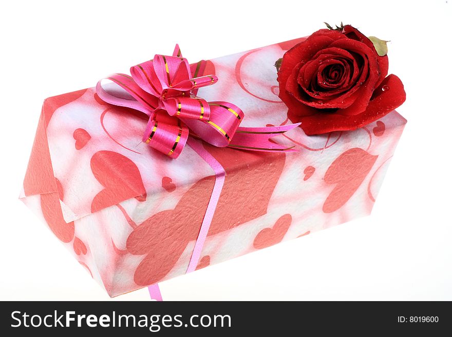 Beautiful gift box with a rose on white. Beautiful gift box with a rose on white.