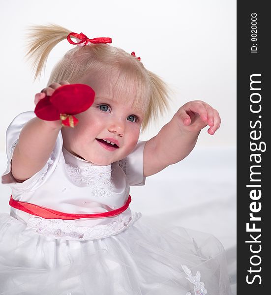 Smiling child shows heart in hand