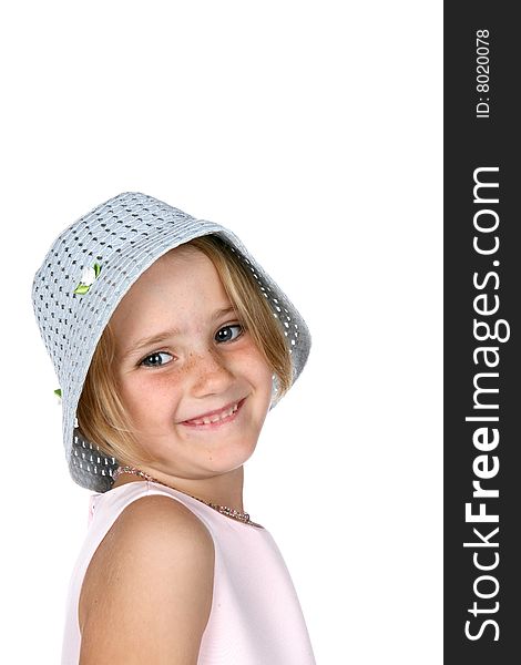 Cute young girl smiling and wearing blue hat. Cute young girl smiling and wearing blue hat