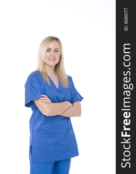 Studio shot of a nurse isolated on white with crossed arms. Studio shot of a nurse isolated on white with crossed arms