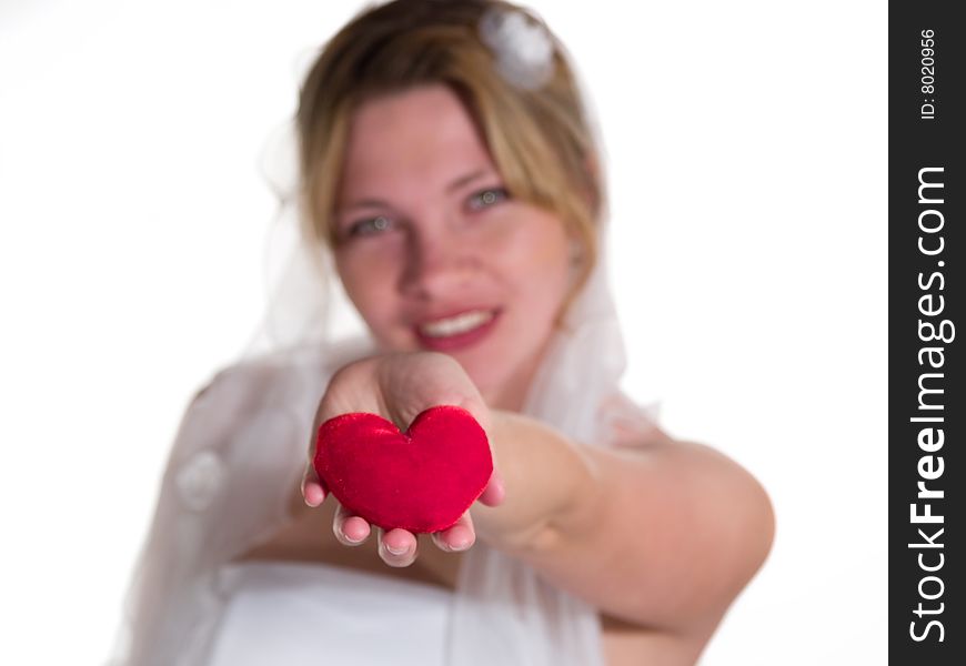 Bride presents red heart