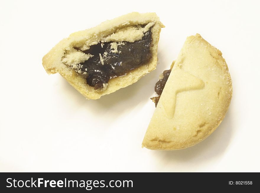 Mincepie cut in half isolated over a white background
