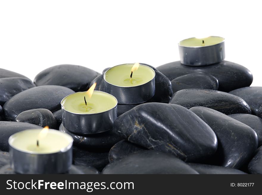 Alight candles and pebbles for spa session. Alight candles and pebbles for spa session