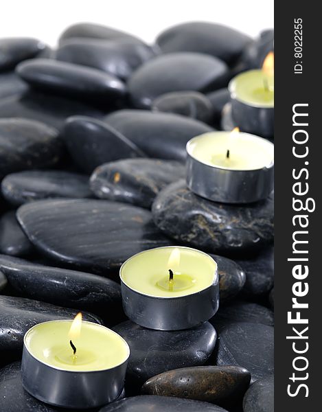 Alight candles and pebbles for spa session. Alight candles and pebbles for spa session