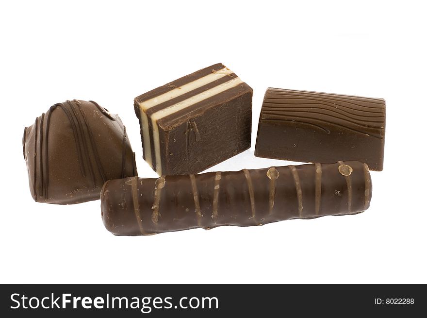 Four chocolate sweets isolated on a white background