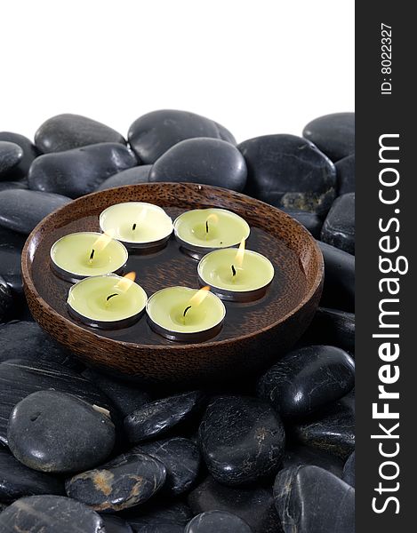 Aromatic candles and pebbles for spa session. Aromatic candles and pebbles for spa session