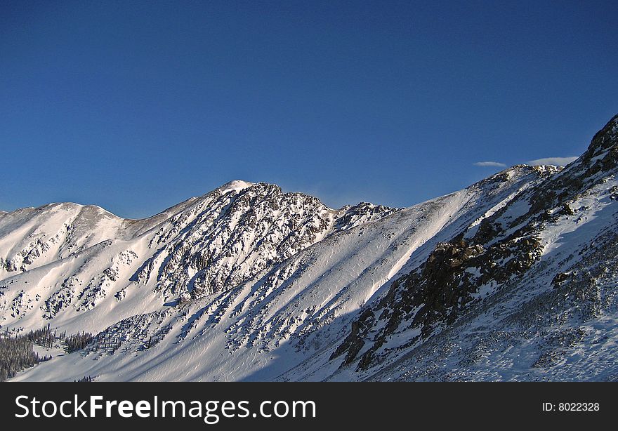 Rocky mountain peaks with snow