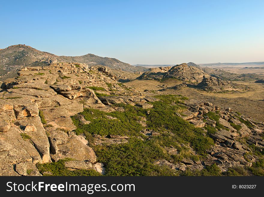 Mountain with rocks under blue sky. Mountain with rocks under blue sky