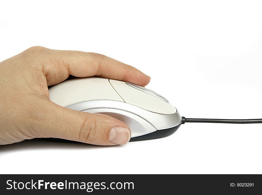 An image of a human hand holding a computer mouse