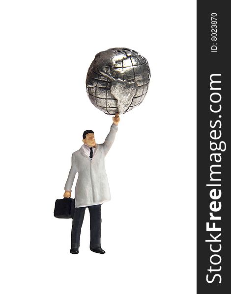 Business figurine holding an earth globe above his head. Business figurine holding an earth globe above his head