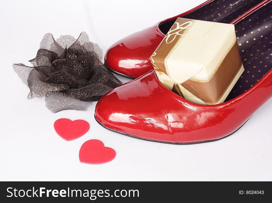 Lady's shoes with present, rose and loving hearts. Lady's shoes with present, rose and loving hearts