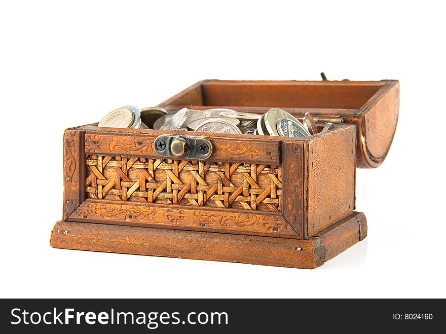 Open wooden chest with lot of coins inside. Isolated over white. Open wooden chest with lot of coins inside. Isolated over white.