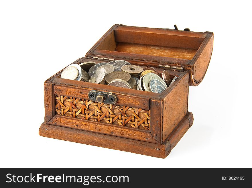 Open wooden chest with lot of coins inside. Isolated over white. Open wooden chest with lot of coins inside. Isolated over white.