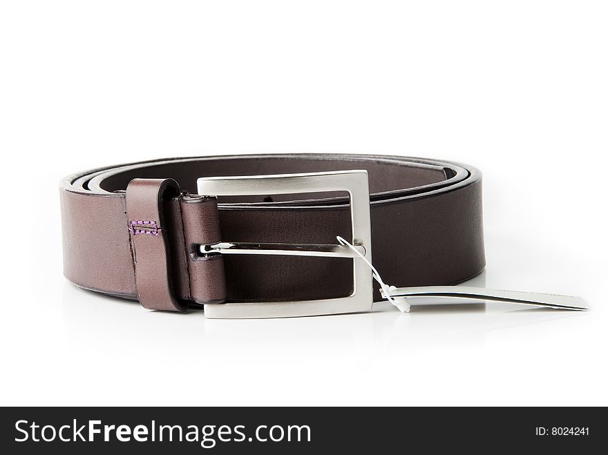 Man's belt with a label over white background