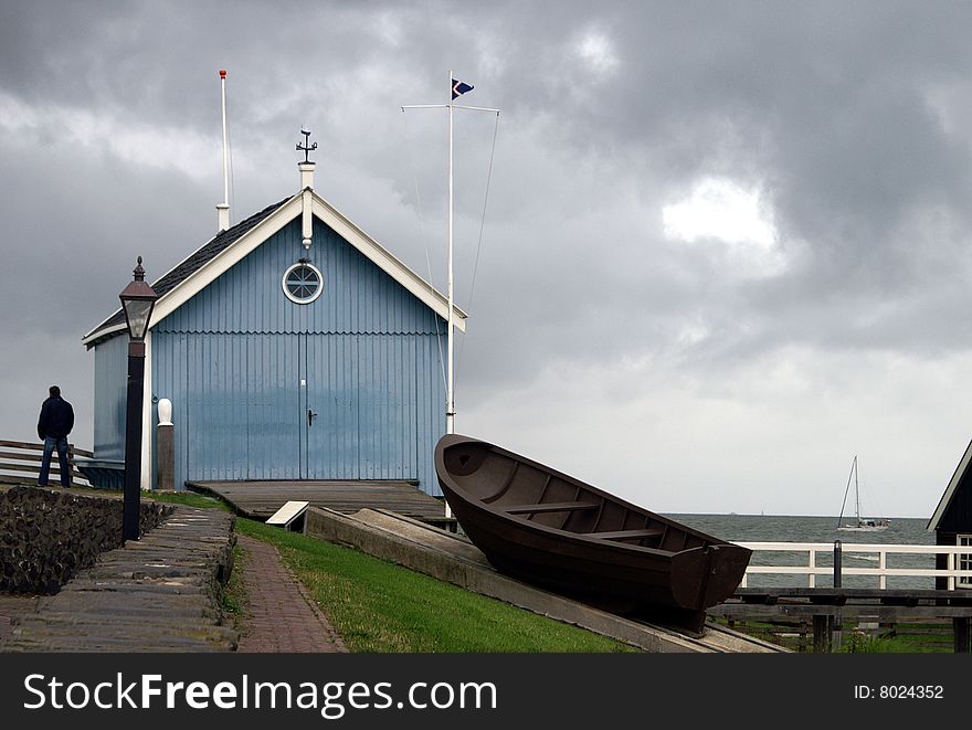 Historic boathouse of a dutch water rescue team on a stormy day. Historic boathouse of a dutch water rescue team on a stormy day