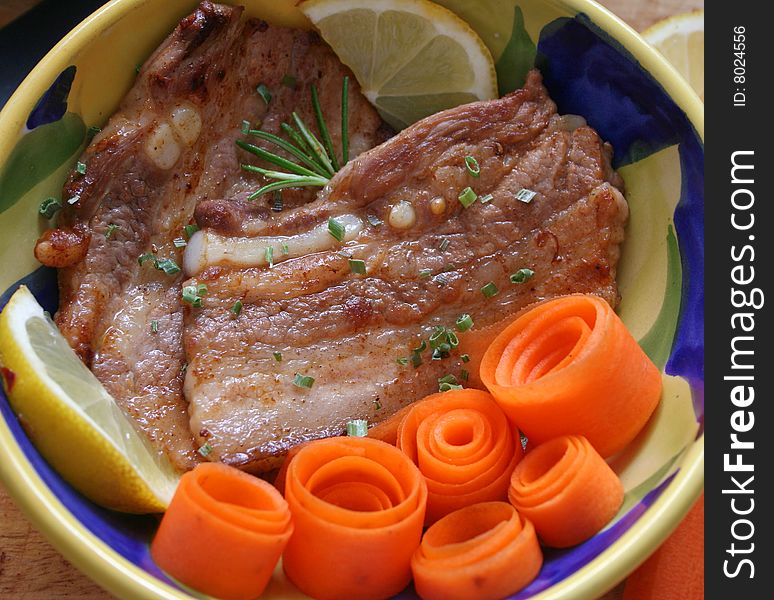 Fresh meat of pork with carrot-salad. Fresh meat of pork with carrot-salad